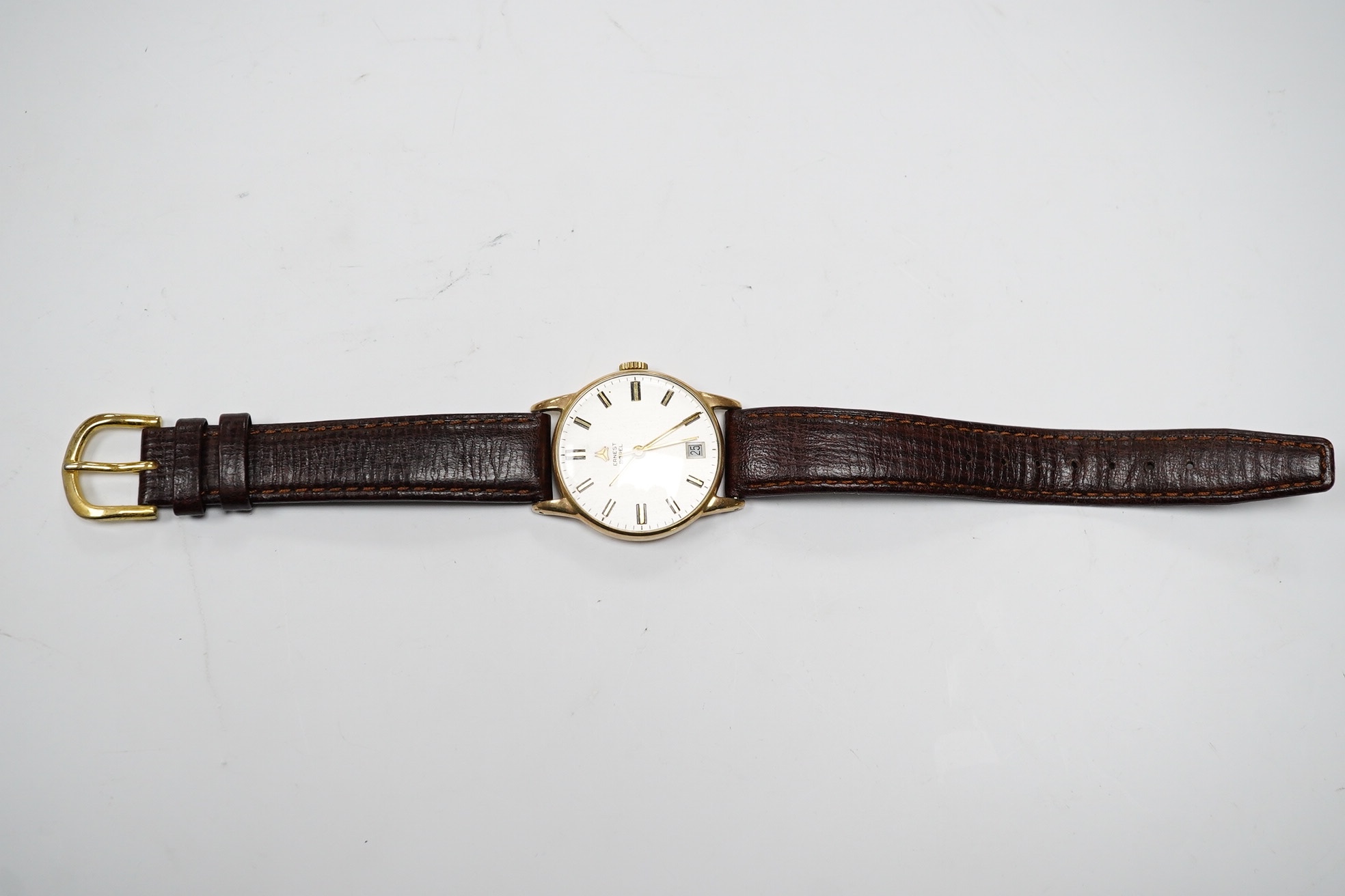 A gentleman's 9ct gold Ernest Borel manual wind wrist watch, with baton numerals and date aperture, case diameter 31mm, on a leather strap. Condition - fair